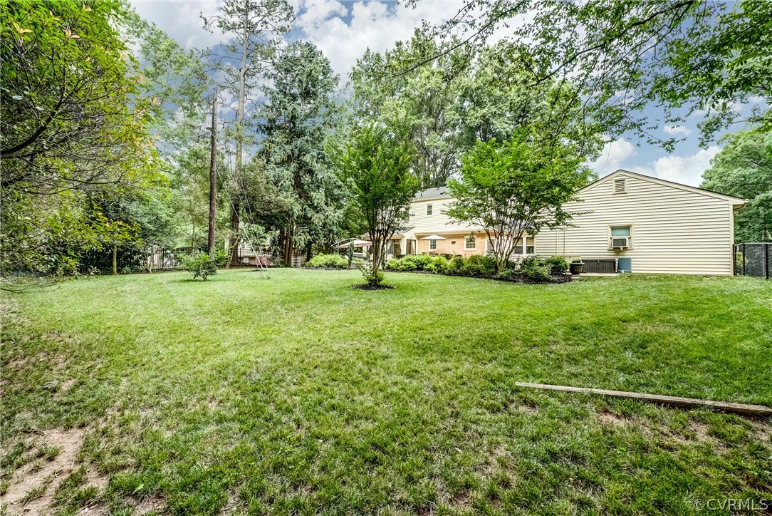 3901 Cheyenne Road Richmond, VA 23235 - Photo 44 of 49 a view of a house with a big yard and large trees