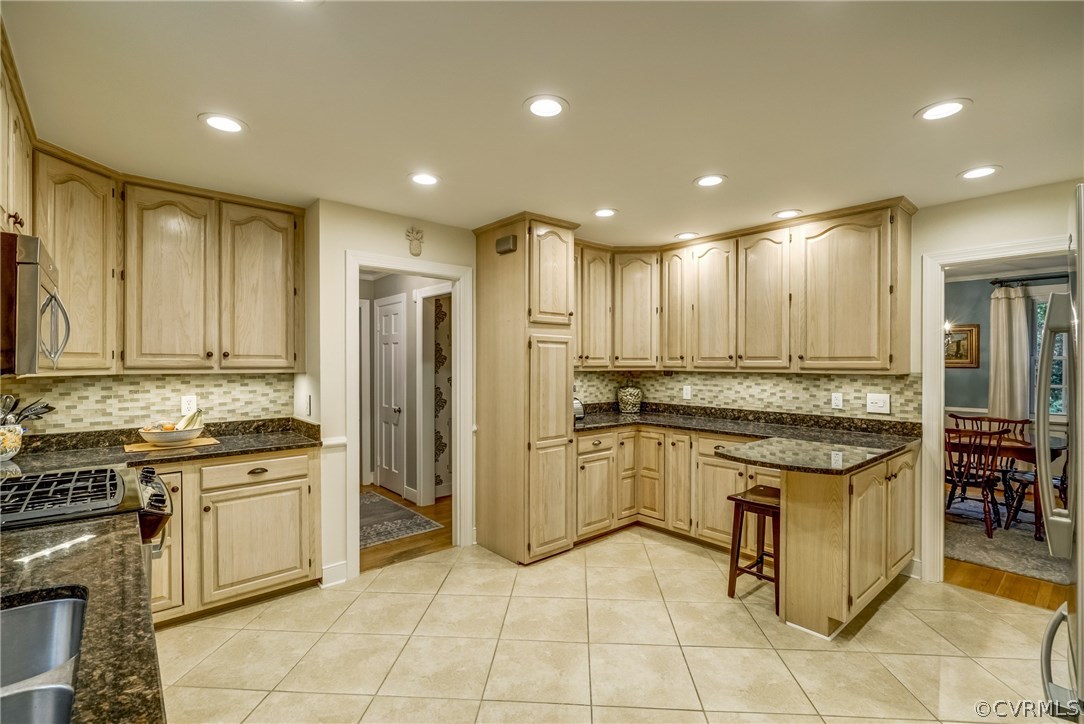 3901 Cheyenne Road Richmond, VA 23235 - Photo 10 of 49 a kitchen with a stove a sink and a refrigerator