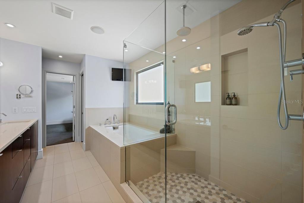 1411 Nottingham Street Orlando, FL 32803 - Photo 27 of 47 a spacious bathroom with a shower sink mirror and toilet