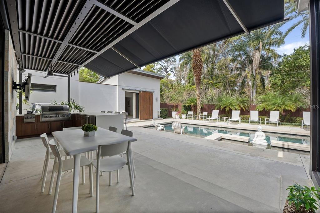 1411 Nottingham Street Orlando, FL 32803 - Photo 38 of 47 a view of a patio with swimming pool table and chairs