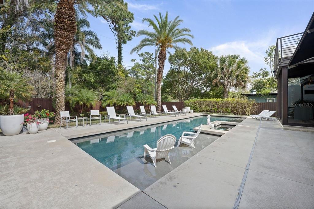 1411 Nottingham Street Orlando, FL 32803 - Photo 41 of 47 a view of a swimming pool with a patio and a garden