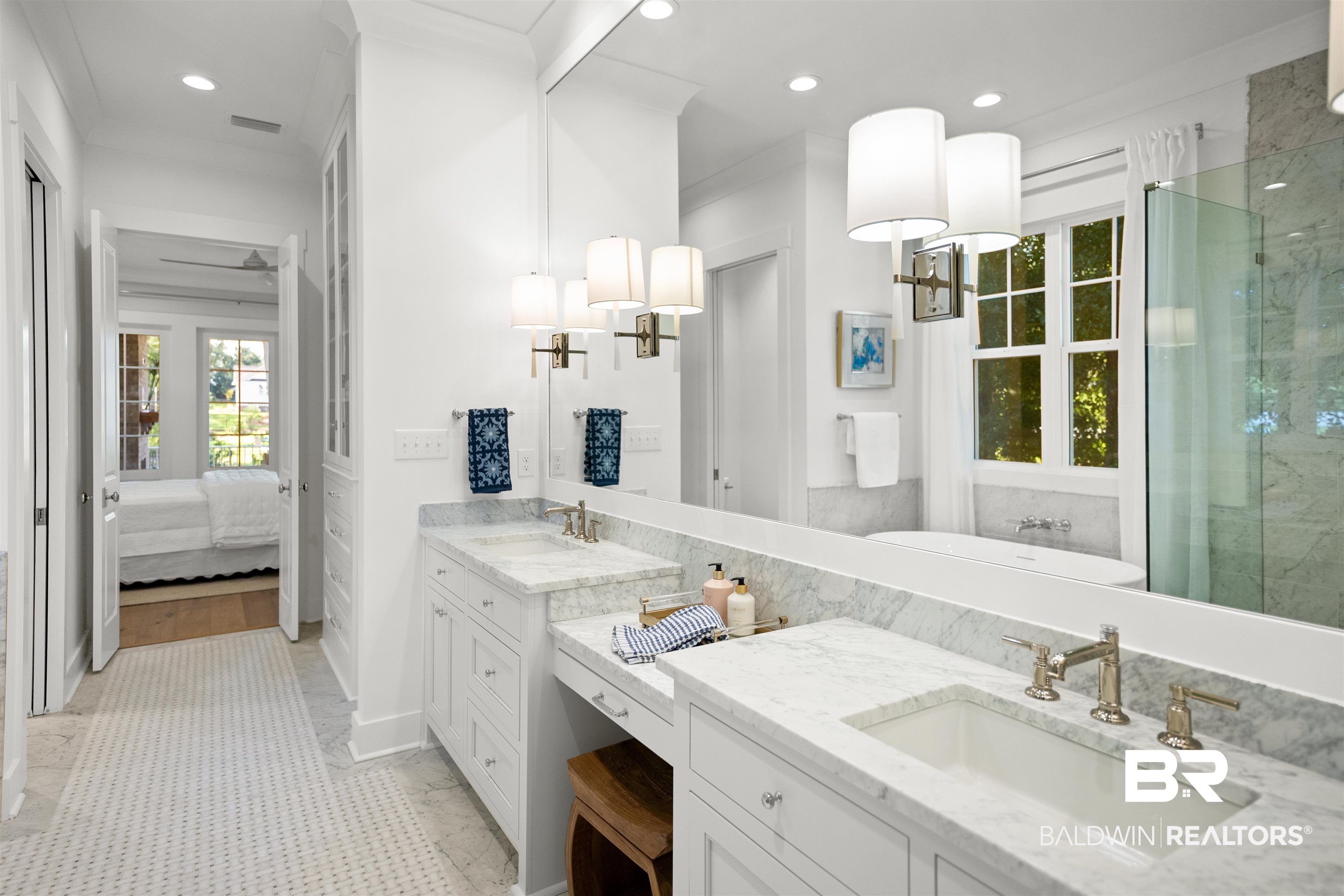 156 Hyacinth Street Fairhope, AL 36532 - Photo 41 of 61 Bathroom with a freestanding bath, two vanities, connected bathroom, recessed lighting, and a marble finish shower