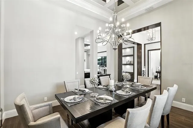 a bathroom with a granite countertop toilet a sink and a mirror