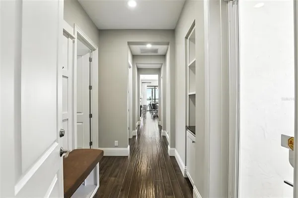 a bathroom with a granite countertop sink mirror vanity and toilet