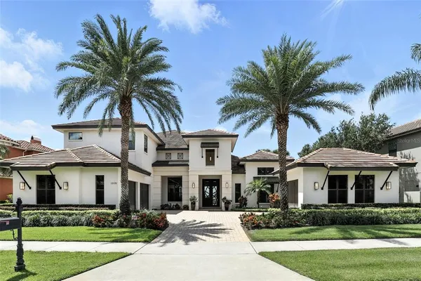 an aerial view of a houses with outdoor space