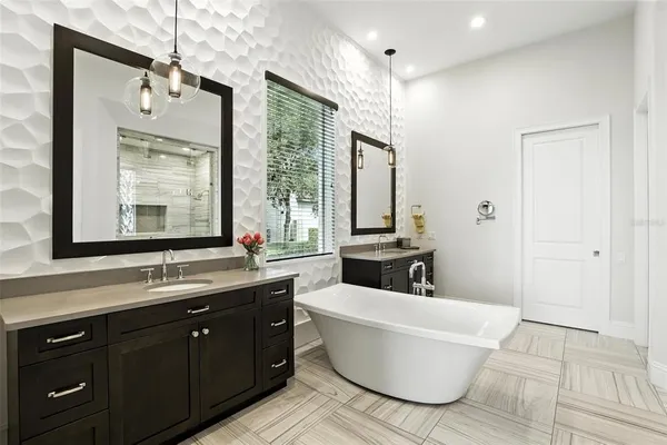a bathroom with a granite countertop sink toilet and mirror