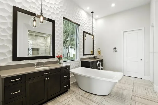 a bathroom with a granite countertop sink toilet and mirror