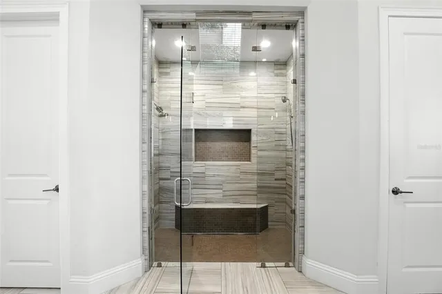 a kitchen with a refrigerator and a sink