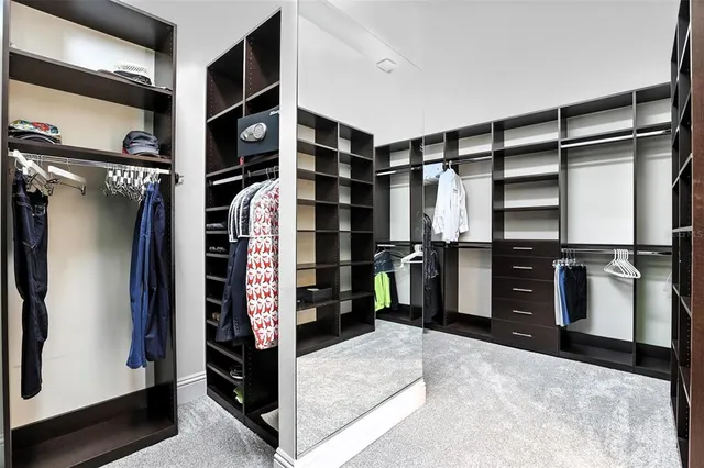 a lobby with furniture and floor to ceiling window