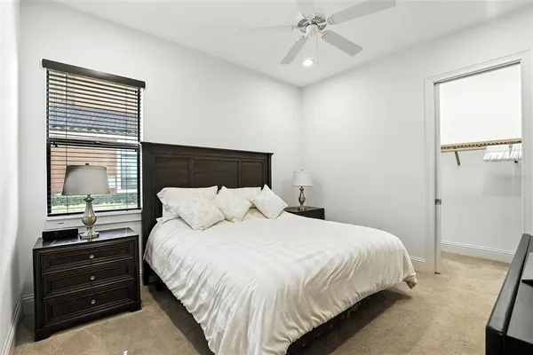 a view of a swimming pool with a table and chairs