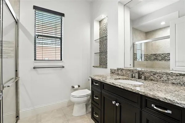 a kitchen with a sink stove and microwave