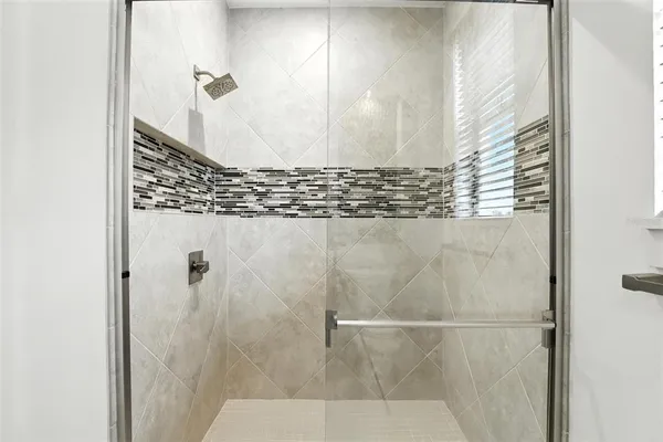 a view of a living room and kitchen with a large window
