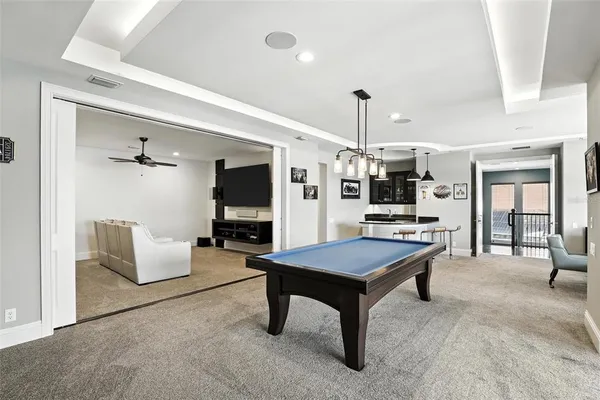 a front view of a house with swimming pool and porch