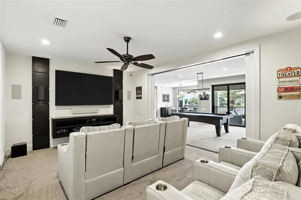 a view of a swimming pool with outdoor seating