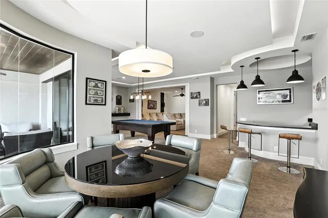 a view of a chairs and table in the balcony