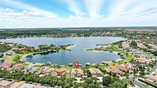 a view of a dining room with furniture and a chandelier