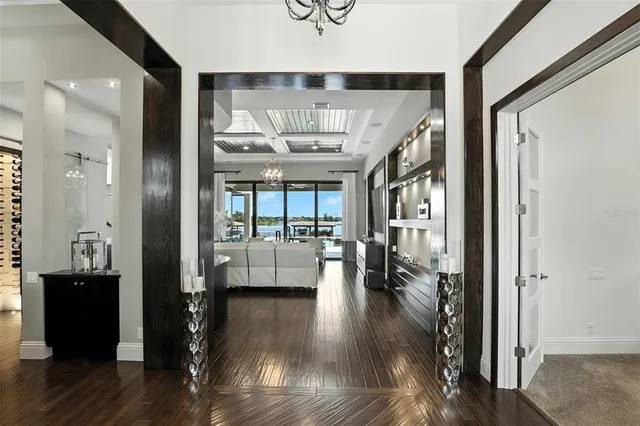 a kitchen with stainless steel appliances granite countertop a sink a stove and a refrigerator