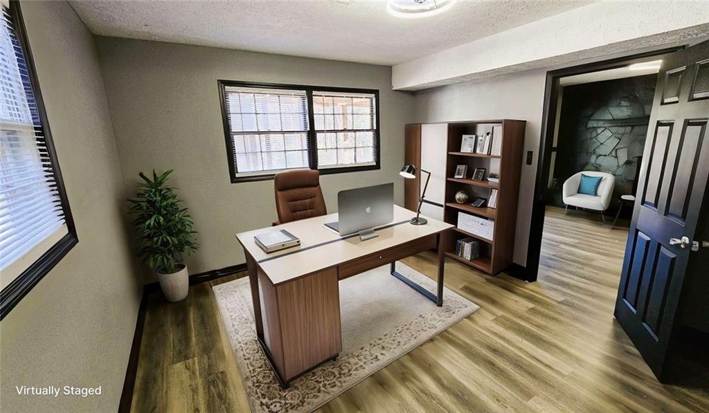 2172 Nancy Way Loganville, GA 30052 - Photo 11 of 21 a view of a workspace with furniture and a potted plant