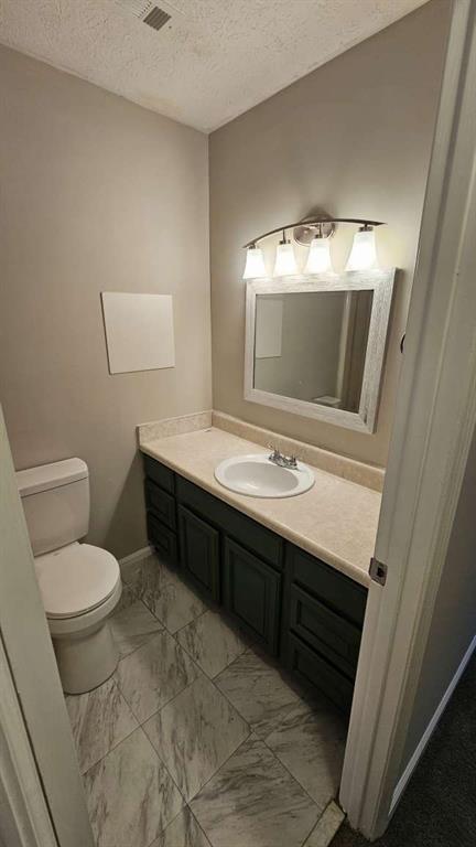 2172 Nancy Way Loganville, GA 30052 - Photo 14 of 21 a bathroom with a sink a toilet and a mirror
