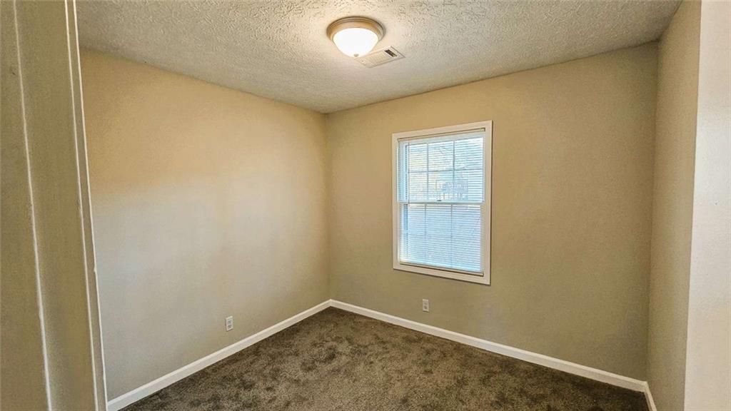 2172 Nancy Way Loganville, GA 30052 - Photo 19 of 21 an empty room with windows