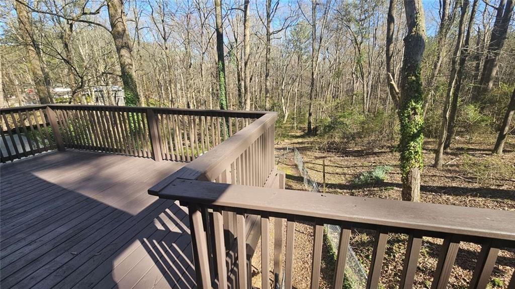2172 Nancy Way Loganville, GA 30052 - Photo 20 of 21 a balcony with wooden floor and fence