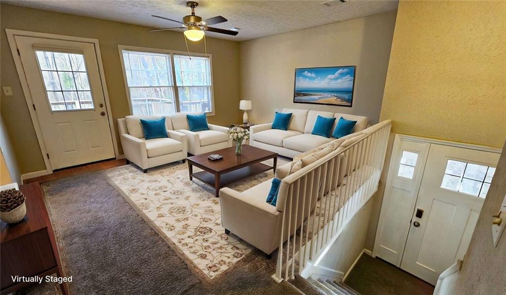 2172 Nancy Way Loganville, GA 30052 - Photo 4 of 21 a living room with couches and a flat screen tv