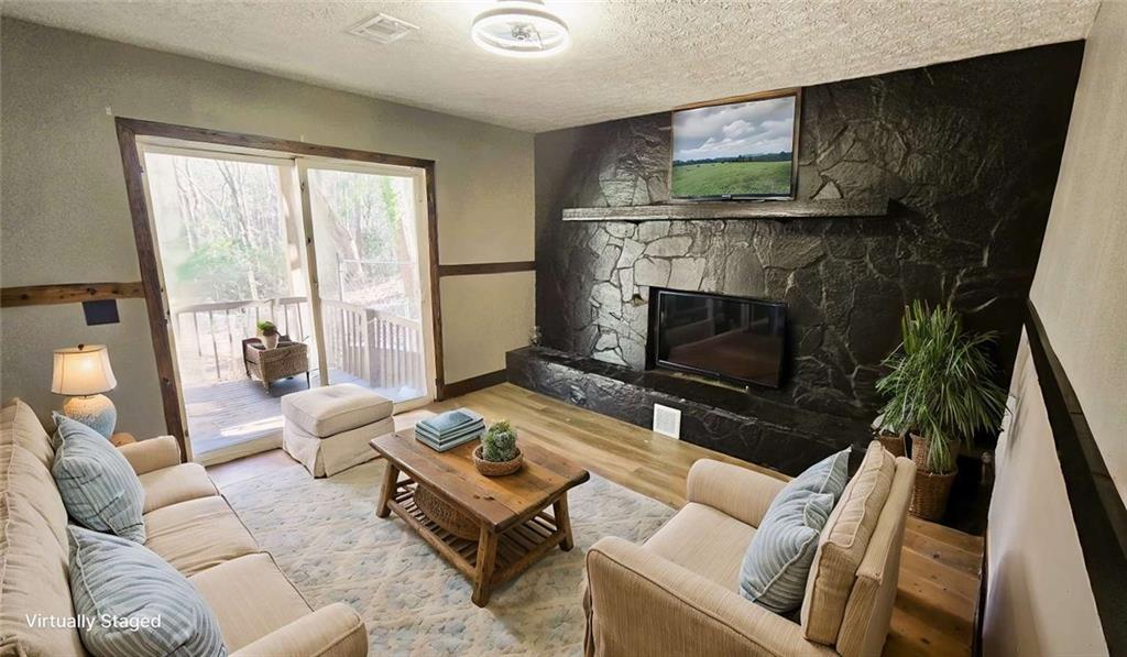 2172 Nancy Way Loganville, GA 30052 - Photo 6 of 21 a living room with furniture and a fireplace