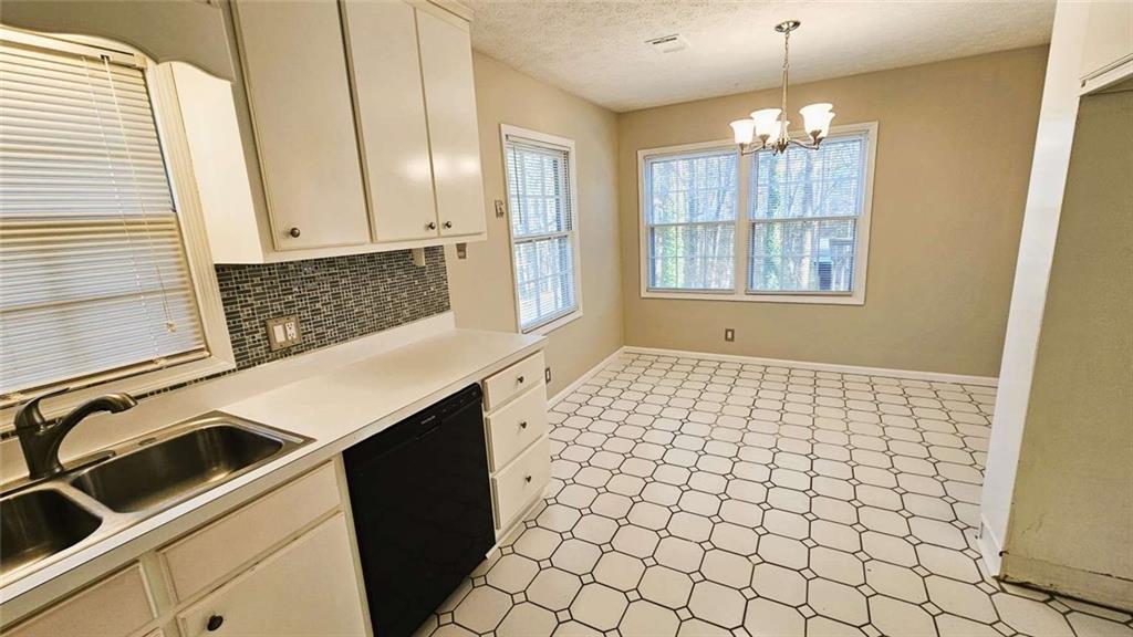 2172 Nancy Way Loganville, GA 30052 - Photo 7 of 21 a view of a kitchen with a sink and cabinets