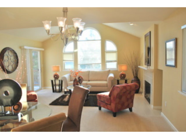 517 Monterey Road Pacifica, CA 94044 - Photo 4 of 17 a living room with fireplace furniture and a large window