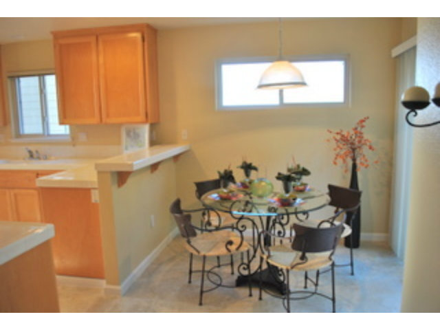 517 Monterey Road Pacifica, CA 94044 - Photo 8 of 17 a view of a dining room with furniture and a window