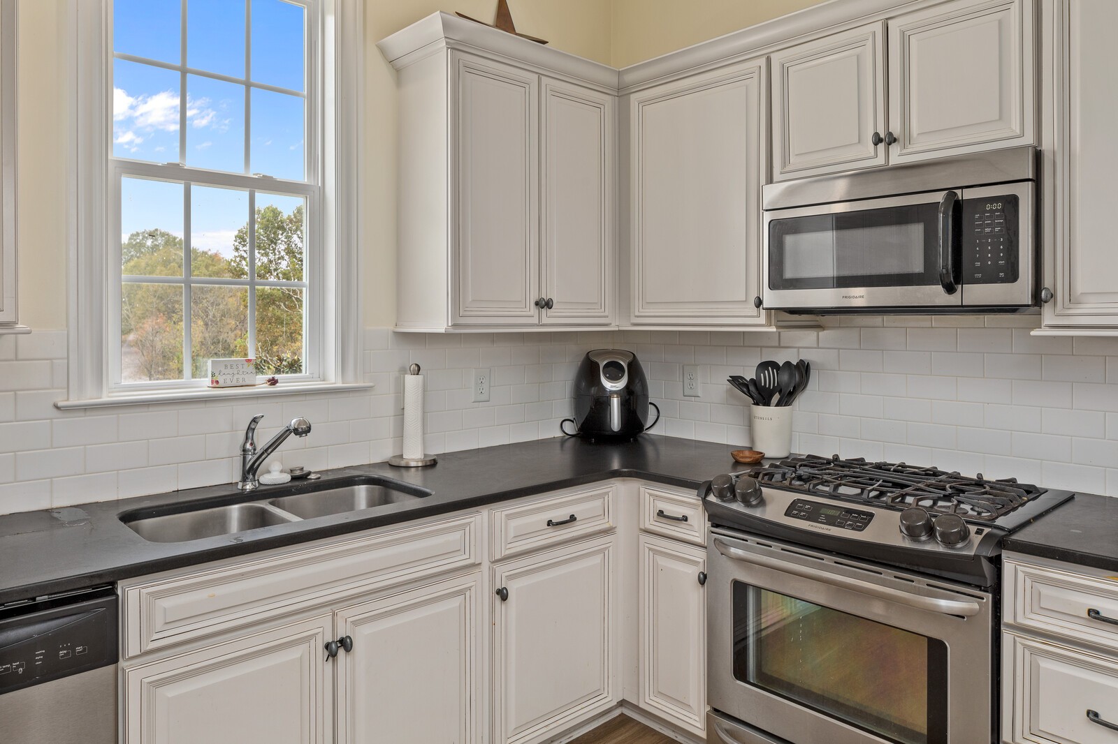 3350 Bailey Road Franklin, TN 37064 - Photo 34 of 37 a kitchen with stainless steel appliances granite countertop white cabinets and a stove top oven
