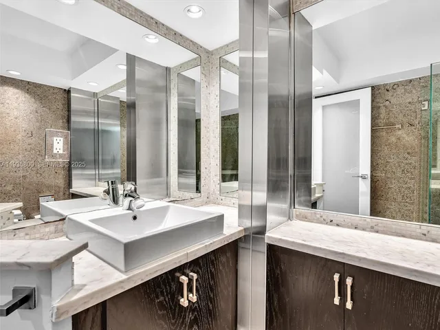 a bathroom with a double vanity sink mirror and double