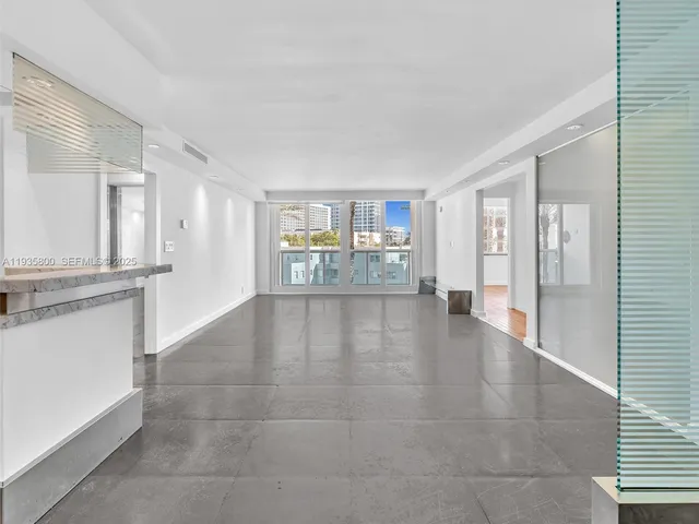 a view of a kitchen with a sink and a window