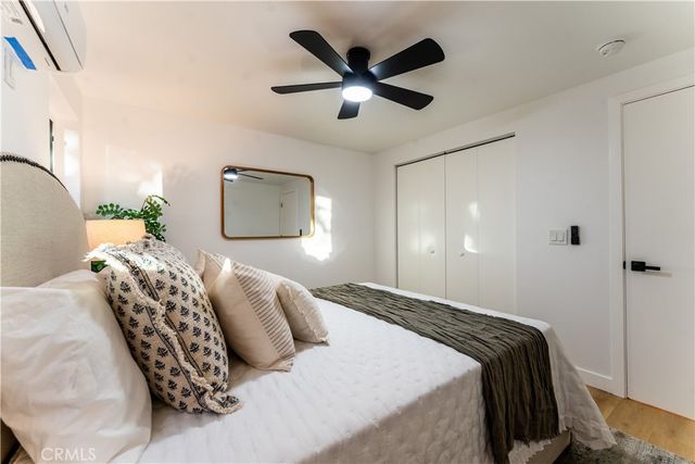 a bedroom with a bed and window