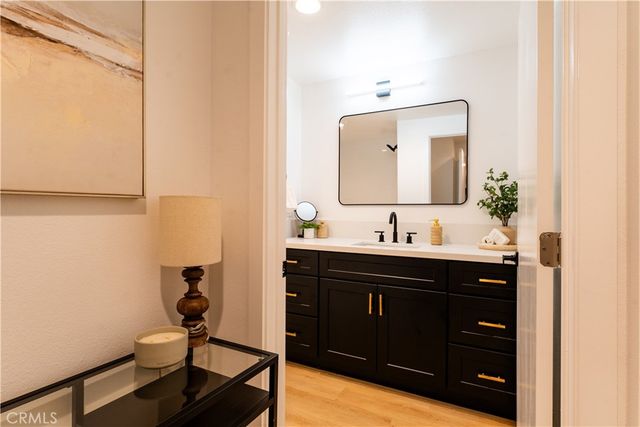 a bathroom with a double vanity sink and a mirror
