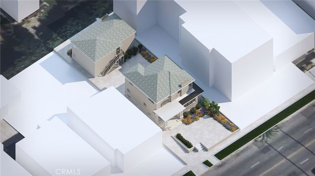 an aerial view of a house with a yard