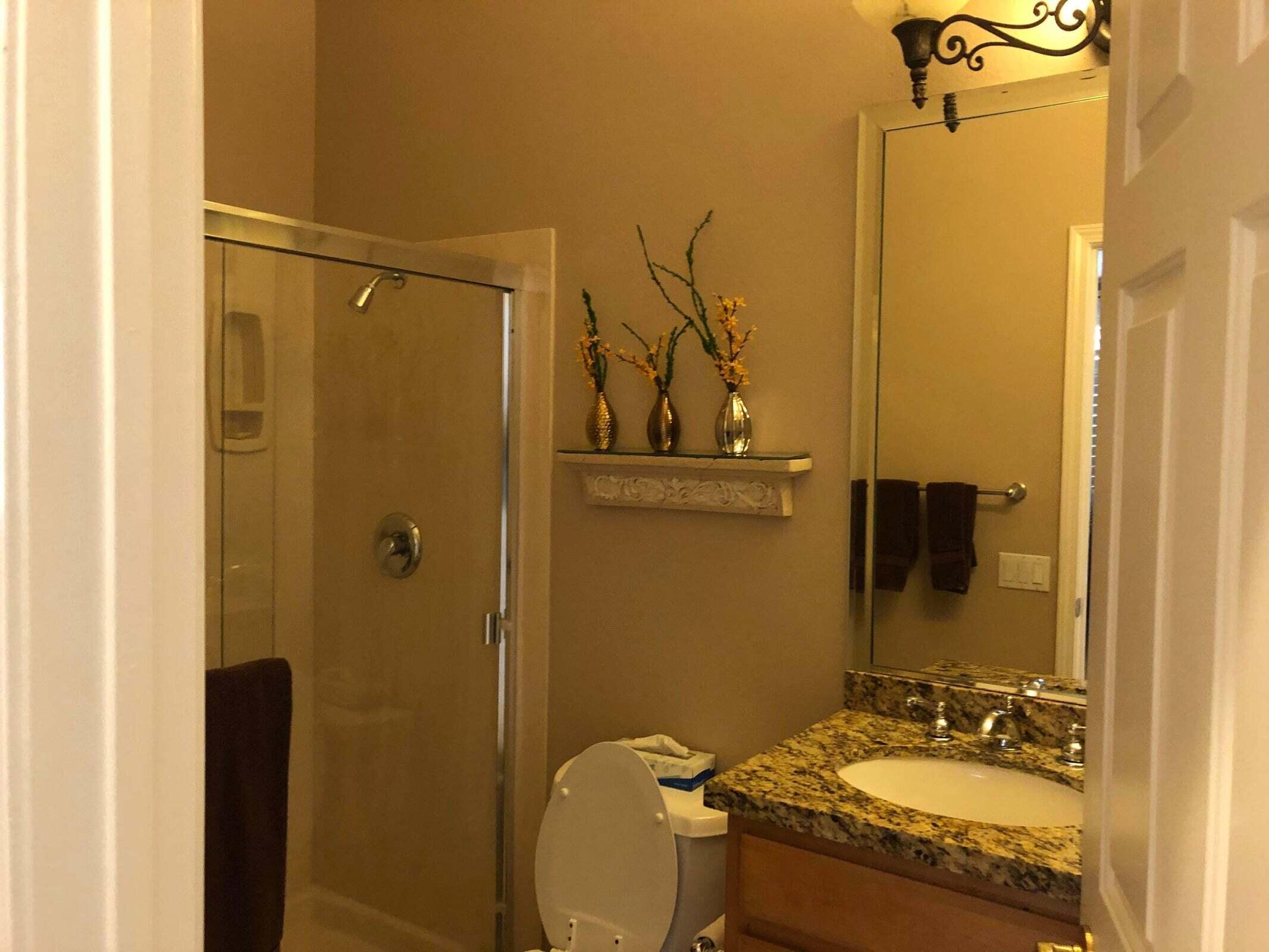 36583 Fan Palm Way Palm Desert, CA 92211 - Photo 11 of 16 a bathroom with a granite countertop sink and a mirror