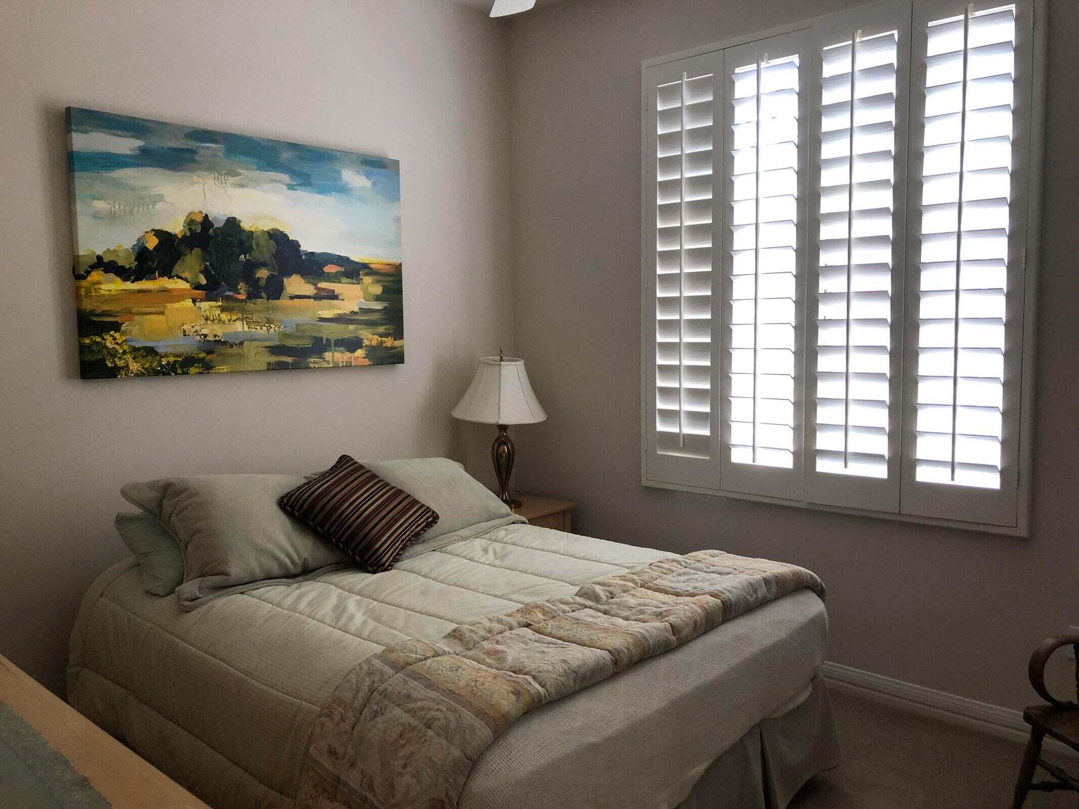36583 Fan Palm Way Palm Desert, CA 92211 - Photo 10 of 16 a bedroom with a bed and wall painting with the window