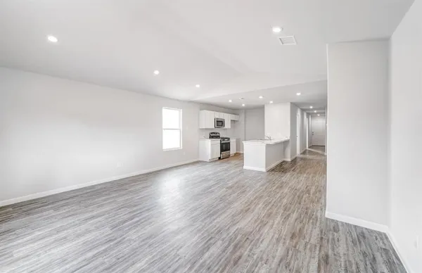 a view of kitchen with a sink and wooden floor