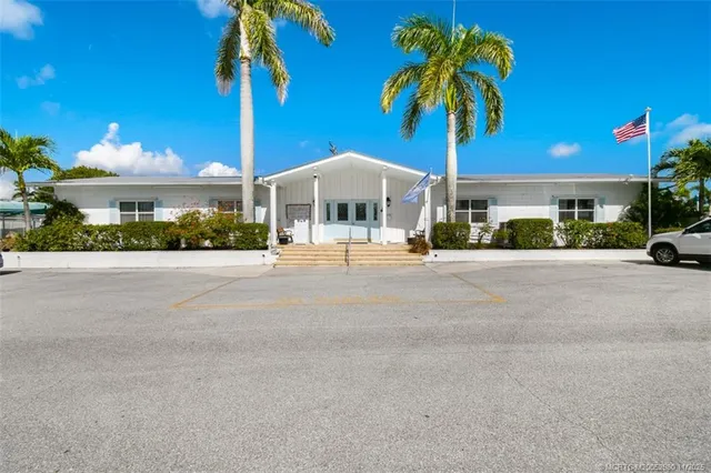 a view of a swimming pool with a yard