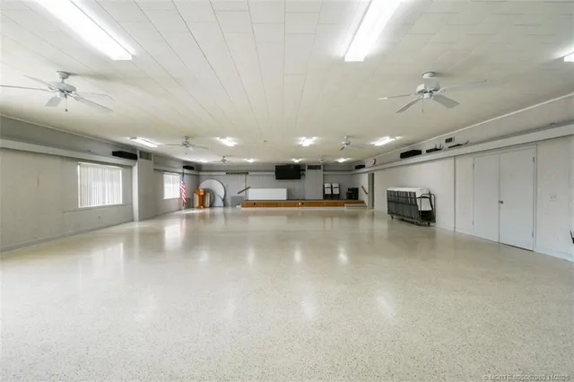 a kitchen with stainless steel appliances granite countertop a refrigerator and a stove