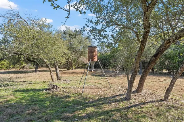 a view of a chairs and table in the patio