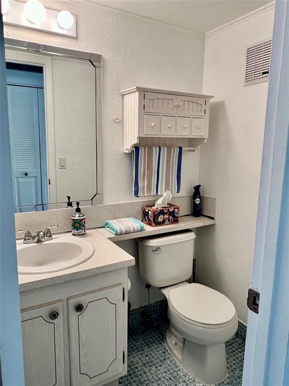 17 Markham A, Unit 17 Deerfield Beach, FL 33442 - Photo 12 of 50 a bathroom with a toilet sink and mirror