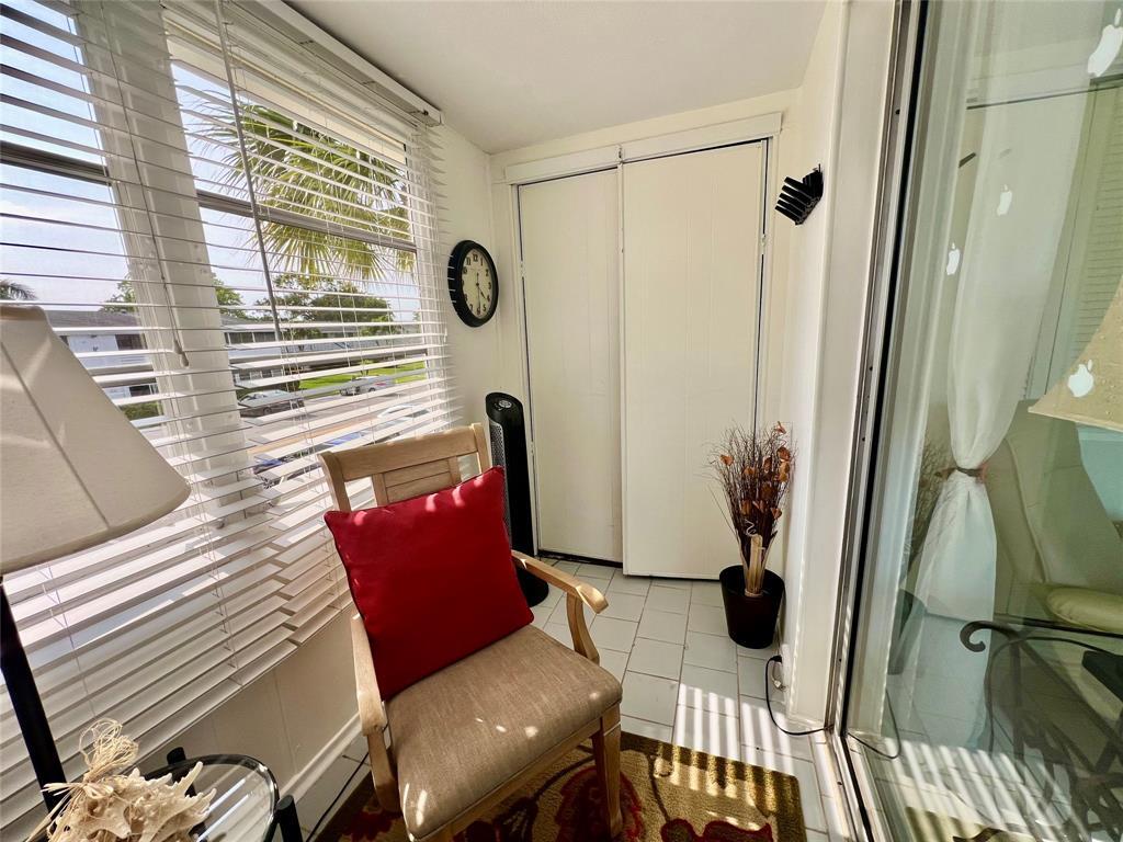 17 Markham A, Unit 17 Deerfield Beach, FL 33442 - Photo 17 of 50 a living room with furniture and a window