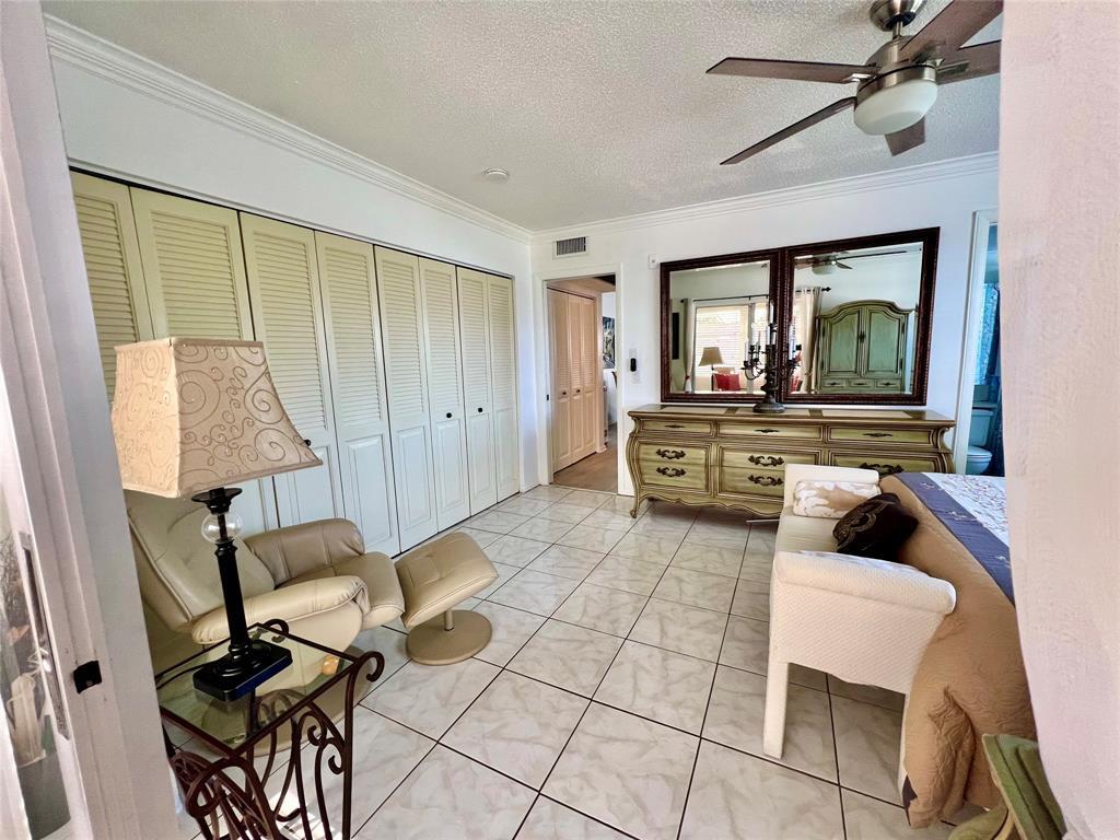 17 Markham A, Unit 17 Deerfield Beach, FL 33442 - Photo 19 of 50 a living room with furniture and a flat screen tv