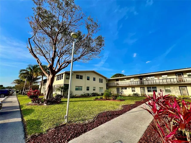 a view of a house with a big yard
