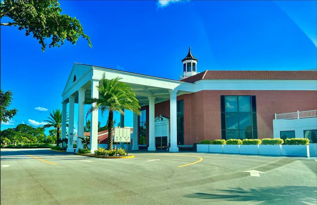 17 Markham A, Unit 17 Deerfield Beach, FL 33442 - Photo 32 of 50 a front view of a house with a yard