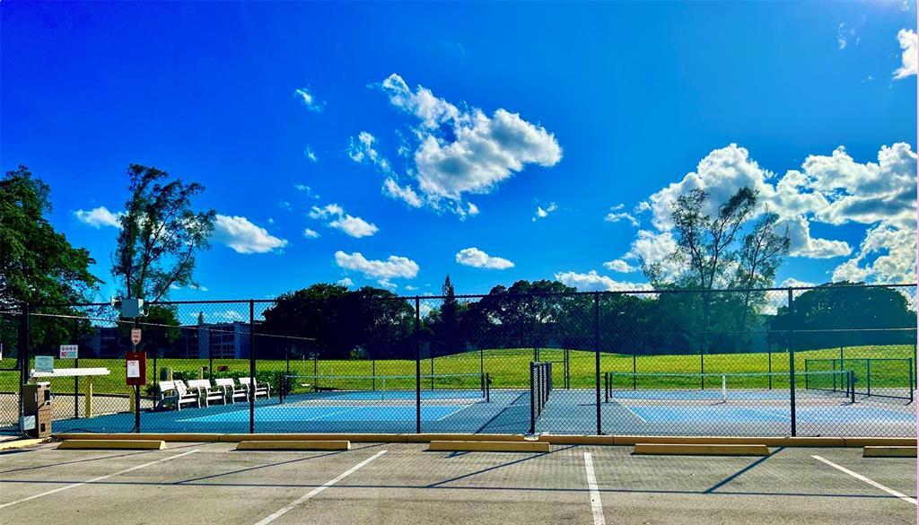17 Markham A, Unit 17 Deerfield Beach, FL 33442 - Photo 40 of 50 a view of a tennis court
