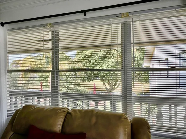 a view of a bedroom with a large window
