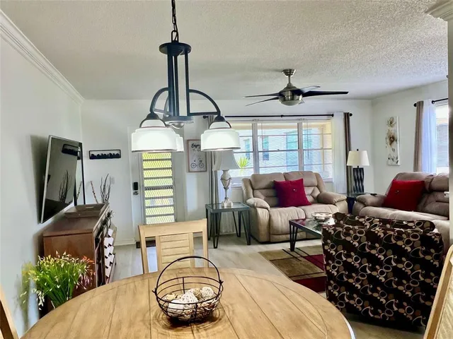 a bedroom with furniture and a chandelier